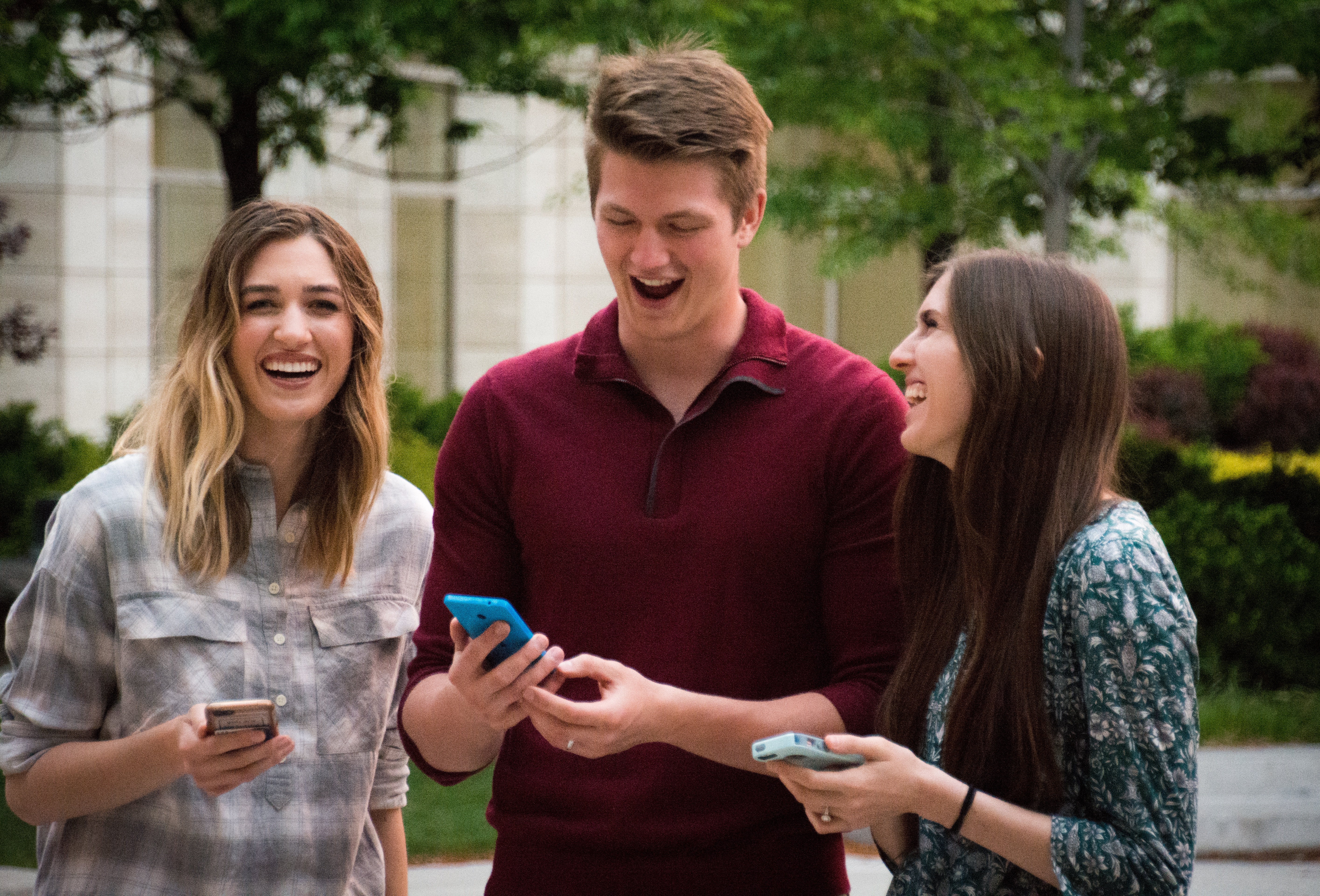 Three young people looking at